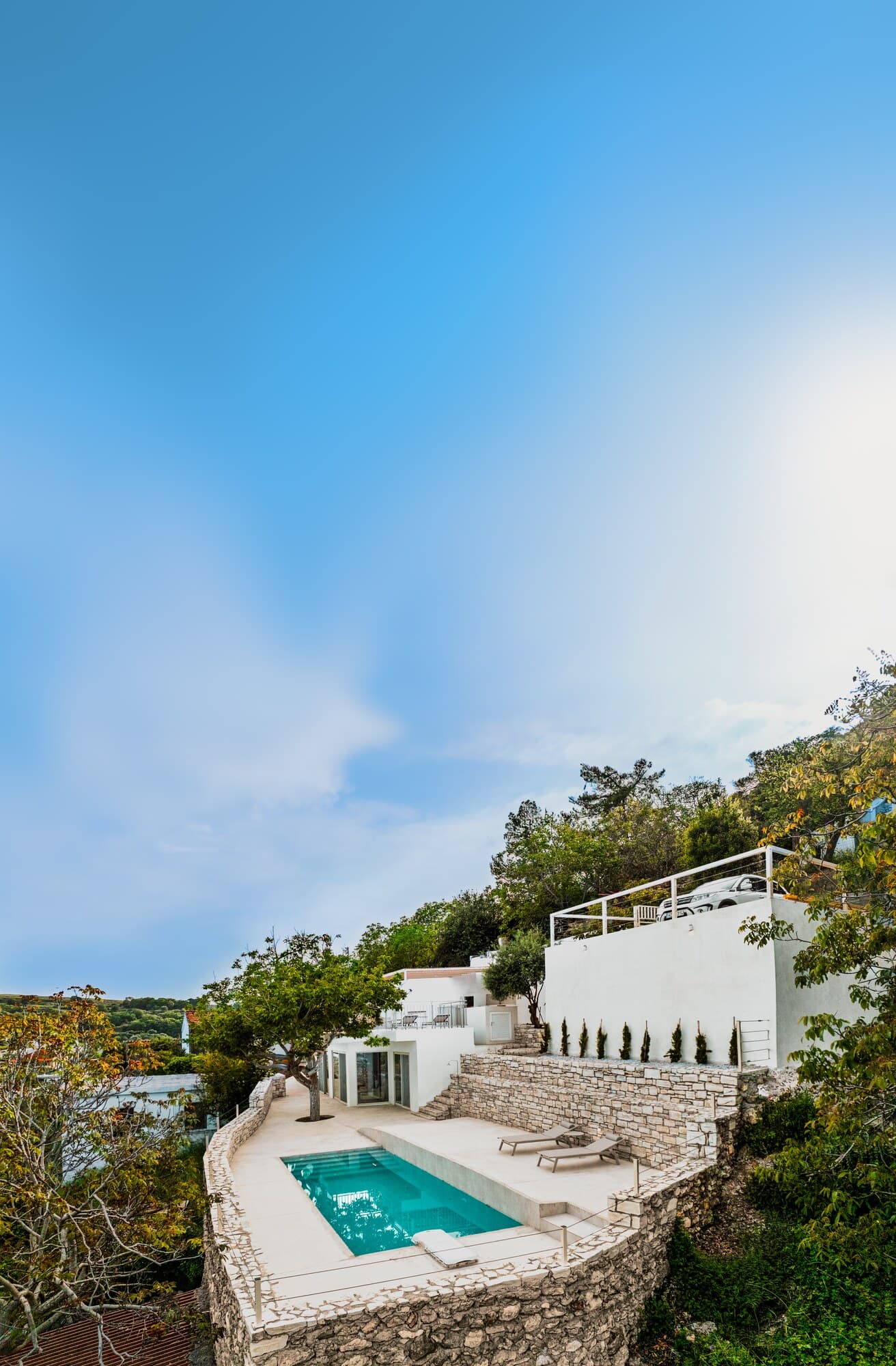 High view of Nogal Retreat terraces, pool, and hillside