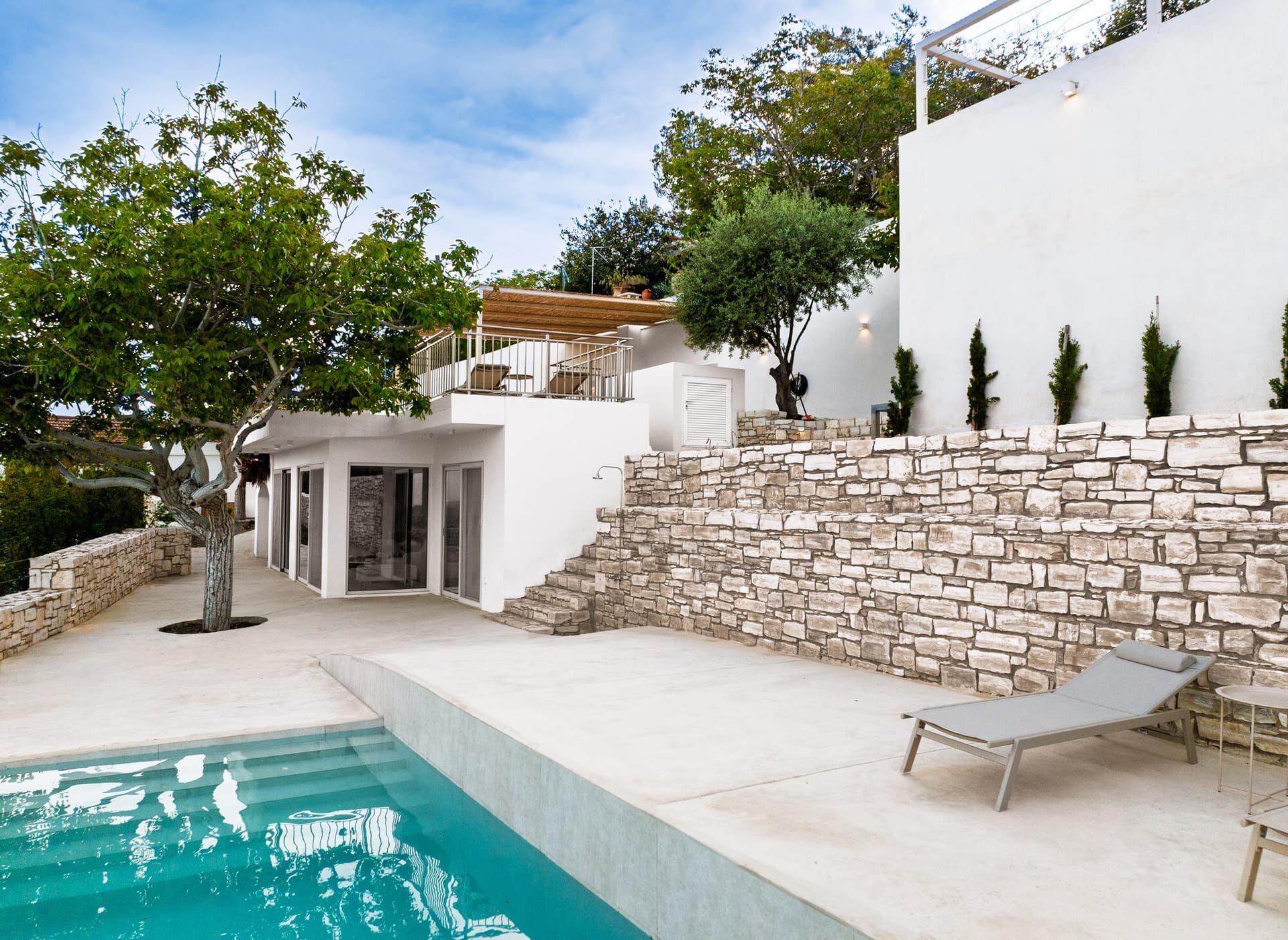 Private pool a level below the house with valley and hills beyond