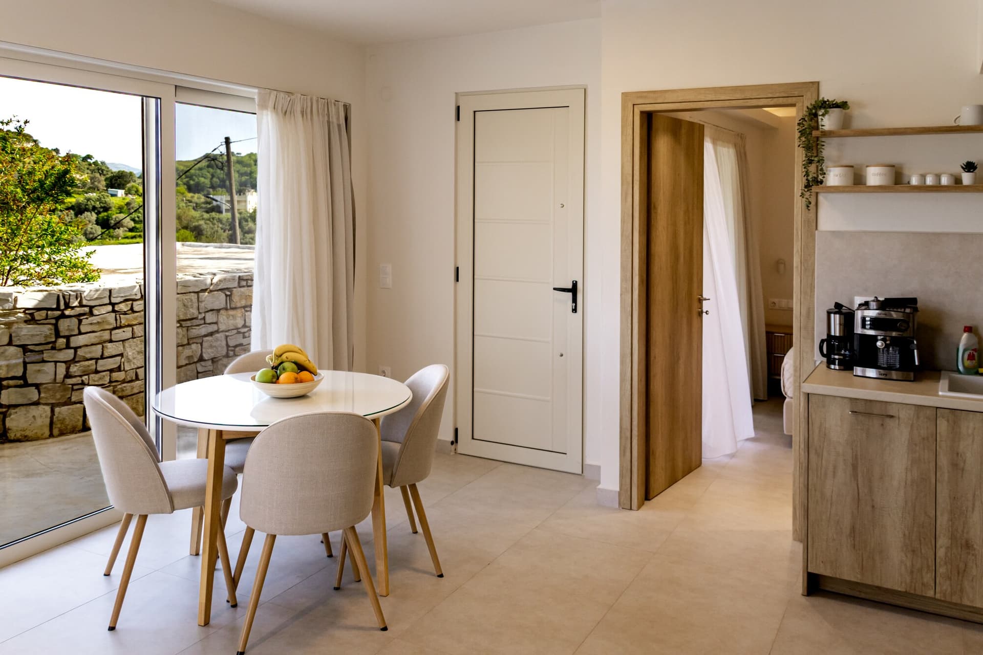 Dining table with fruit bowl and doors open to the patio