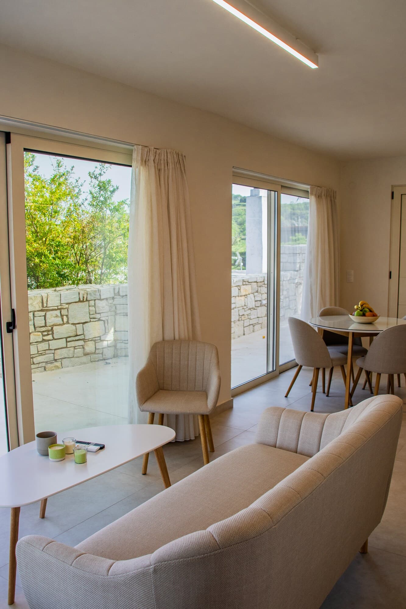 Living and dining space with large doors to the outside