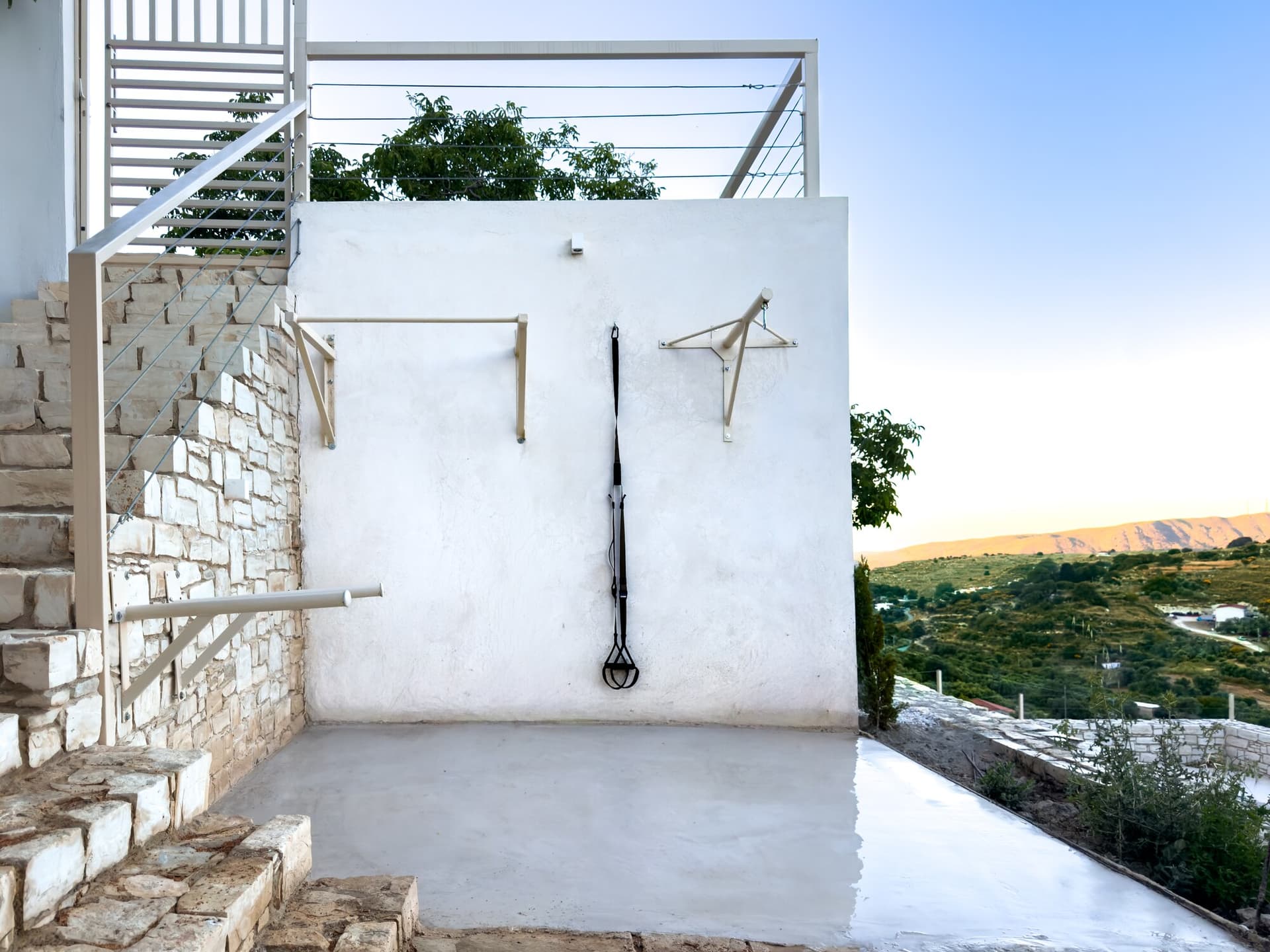 Outdoor fitness wall with valley view beyond