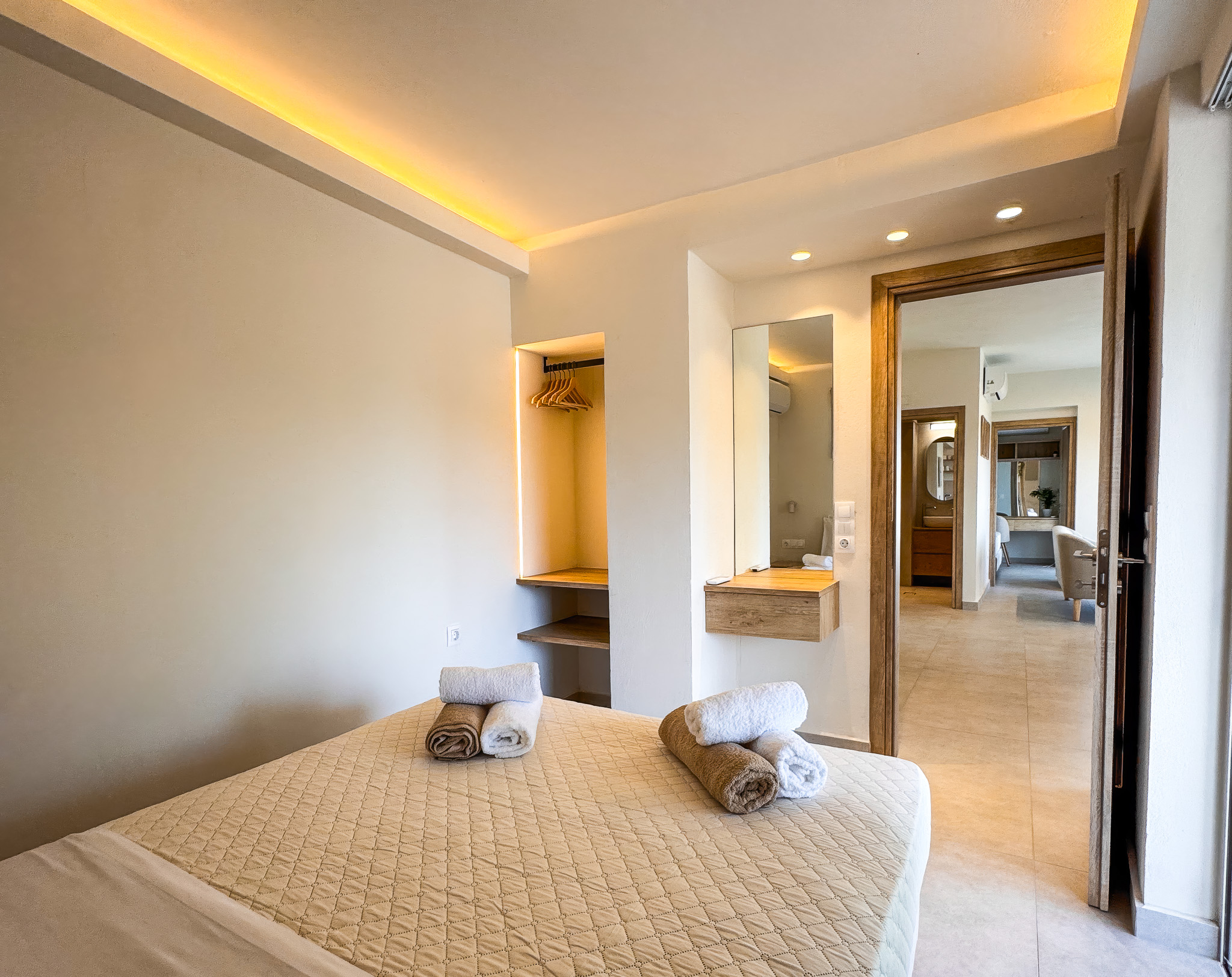 Second bedroom at Nogal Retreat with full bed and bathroom beyond